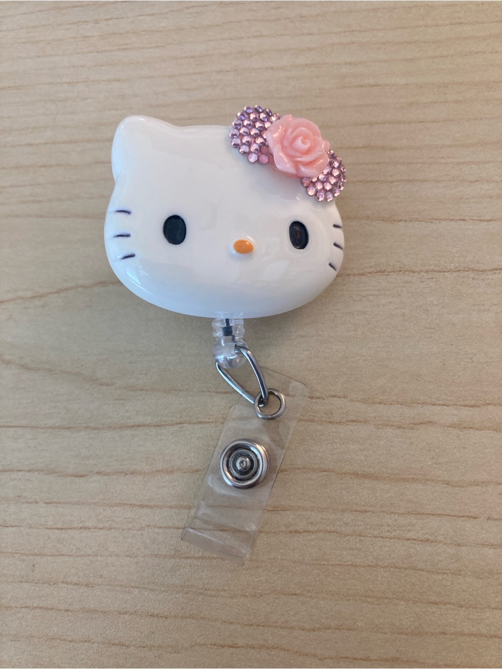 White Hello Kitty Style Badge Reel with Pink Flower Accent